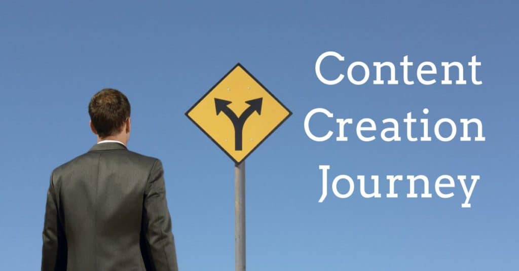 man standing in front of a crossroads sign